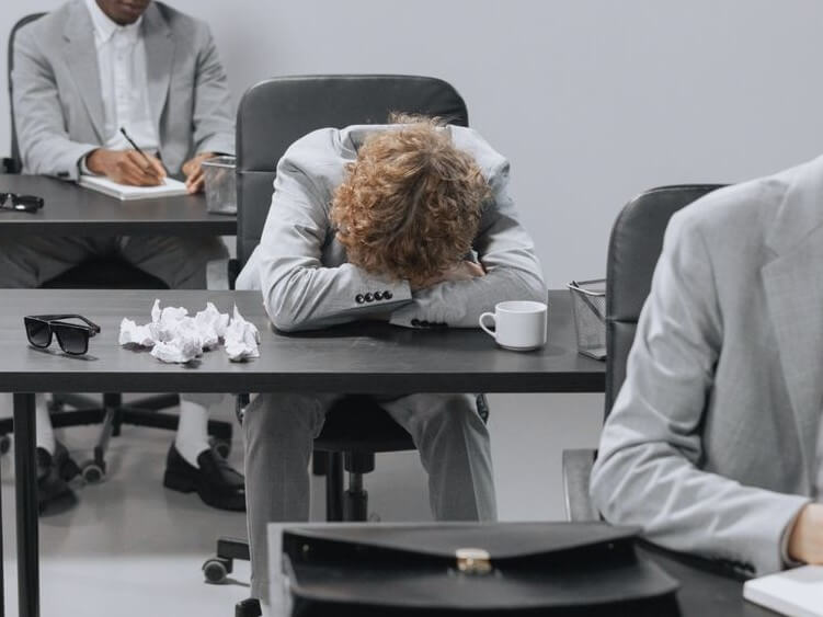 A person bored in a hybrid meeting
