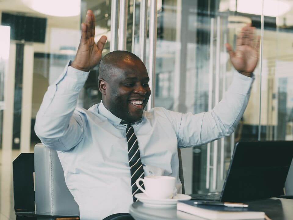 Someone celebrating a good hybrid meeting